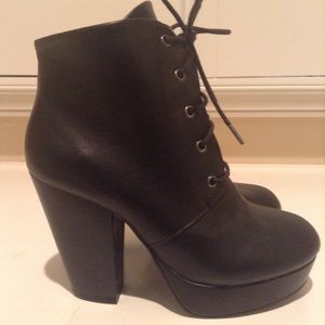 Black heeled boots. Size 7. About 4 inch heel